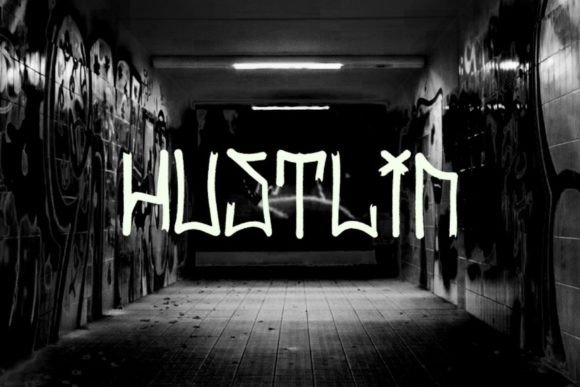 Hustlin Font: Urban Script for Bold Web Headers